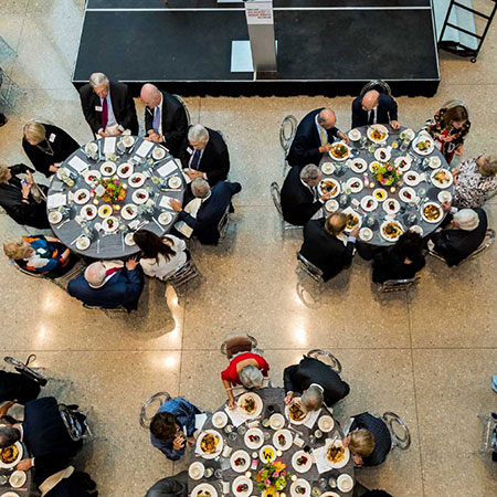 Guests sitting at tables, viewed from above.
