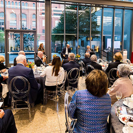 Guests listening to speaker